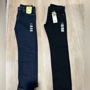 Two pairs of Levi’s 502 Taper Jeans Black and Blue